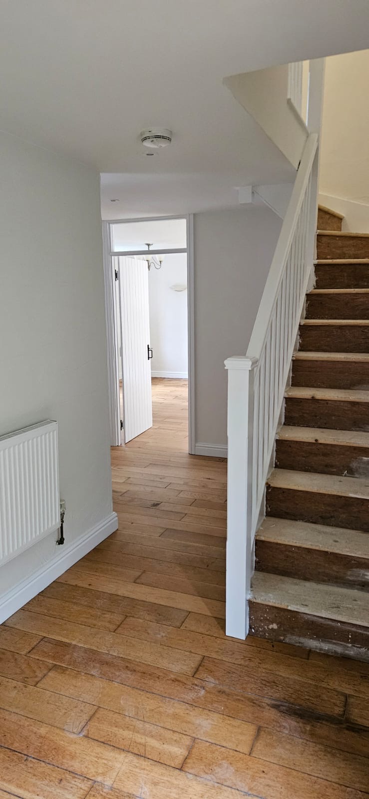 Staircase and landing — natural wood bannisters and panelling